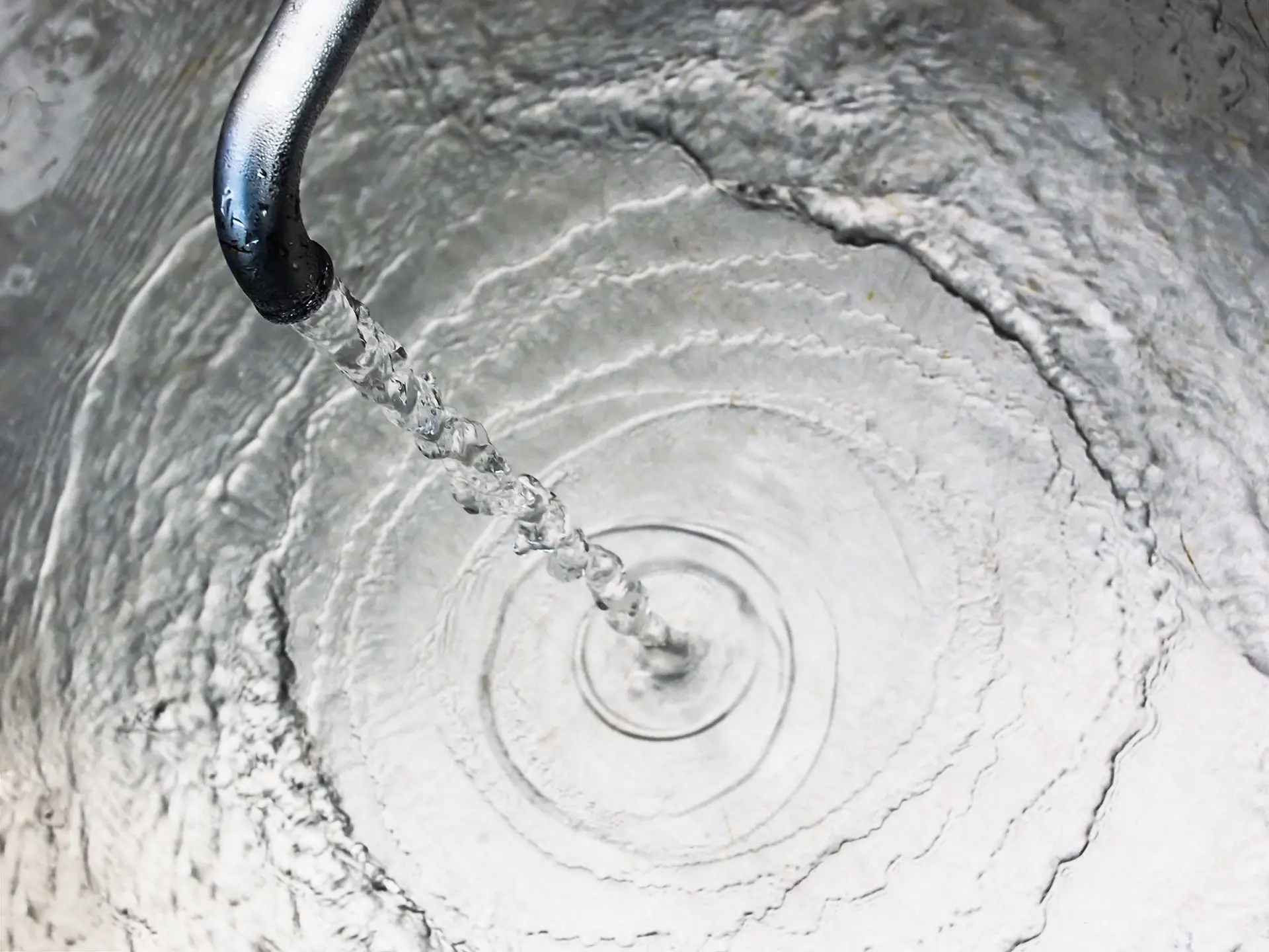 Clean water coming out of a tap into a sink