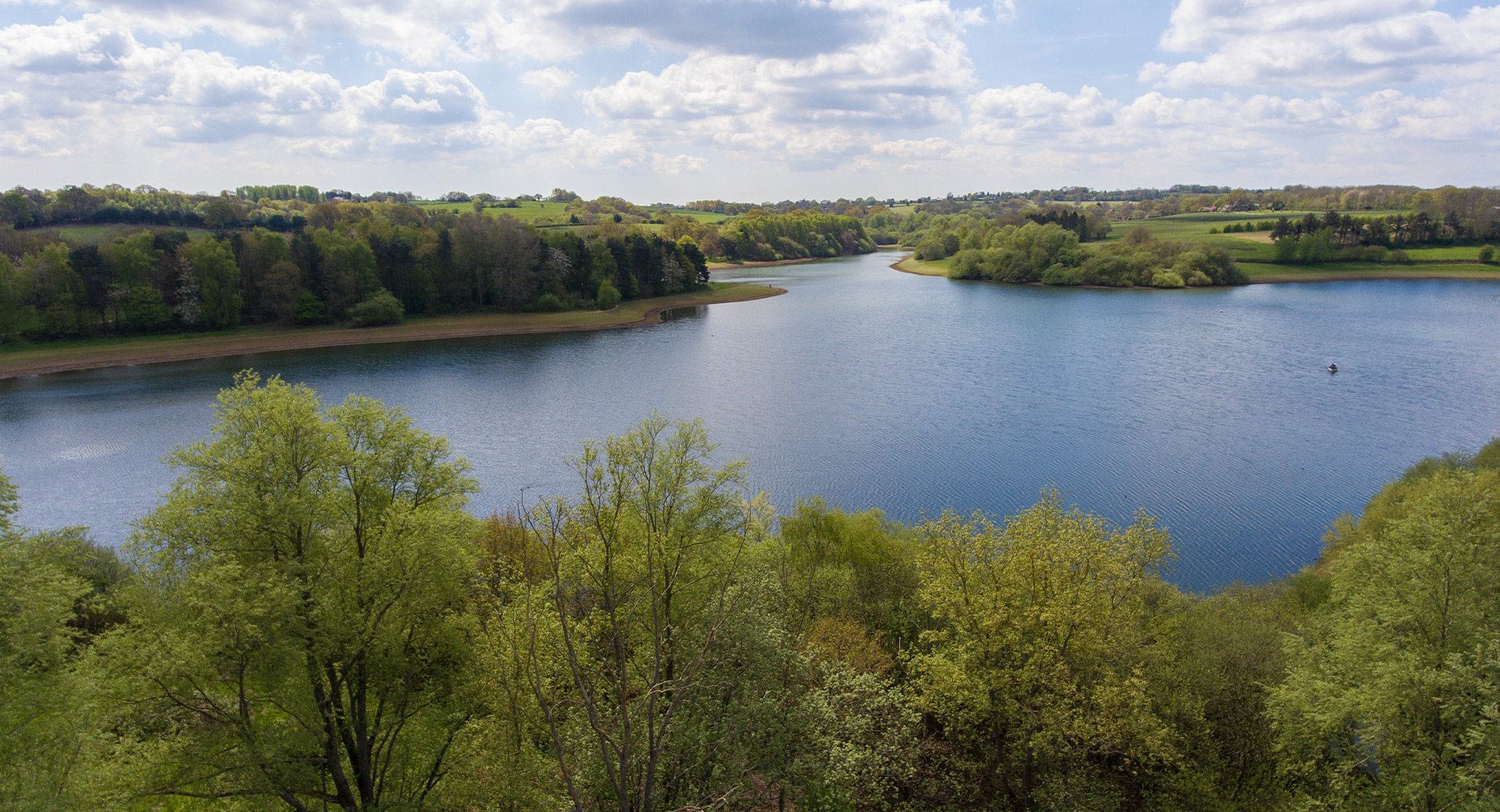 An aerial view of Bewl Water Reservoir and the surrounding woodland 