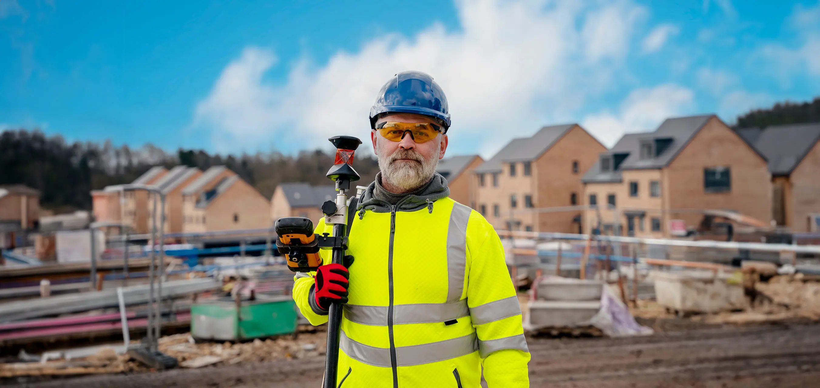 A Southern Water worker posing with equipment on a housing development