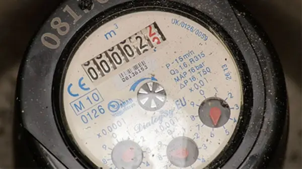 A close up of a water meter reading