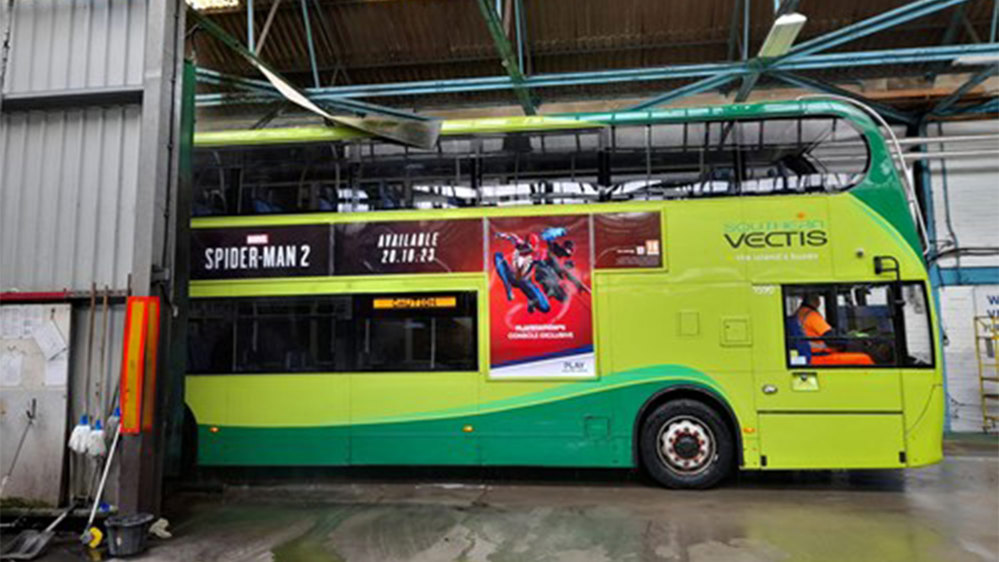 Side on view of a green bus