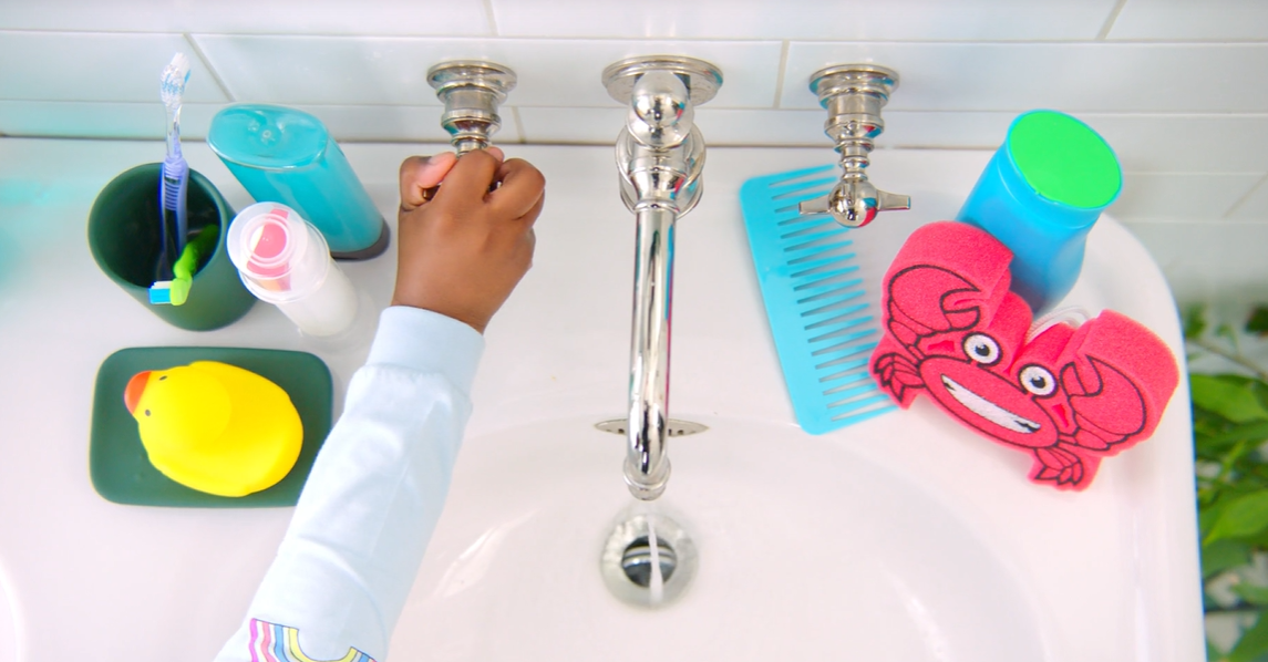 Family bathroom sink with kids toys