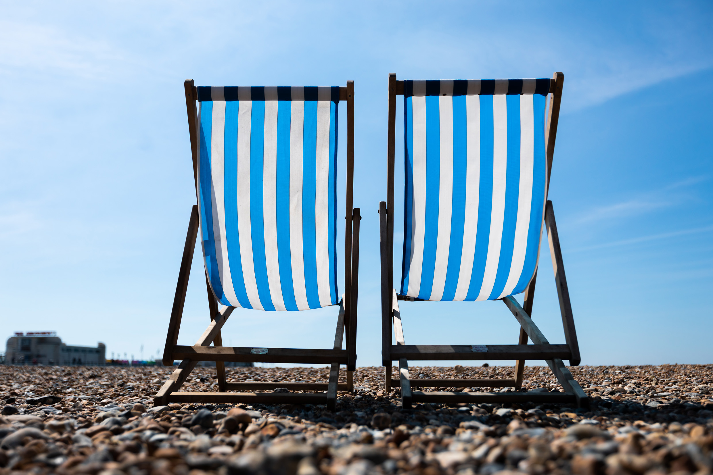 Two deckchairs on Worthing Beach on a sunny day