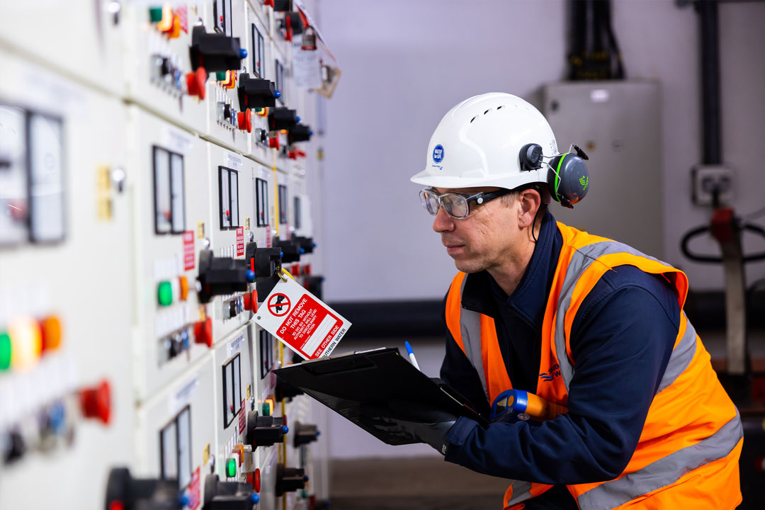 Member of the water treatment team with clipboard