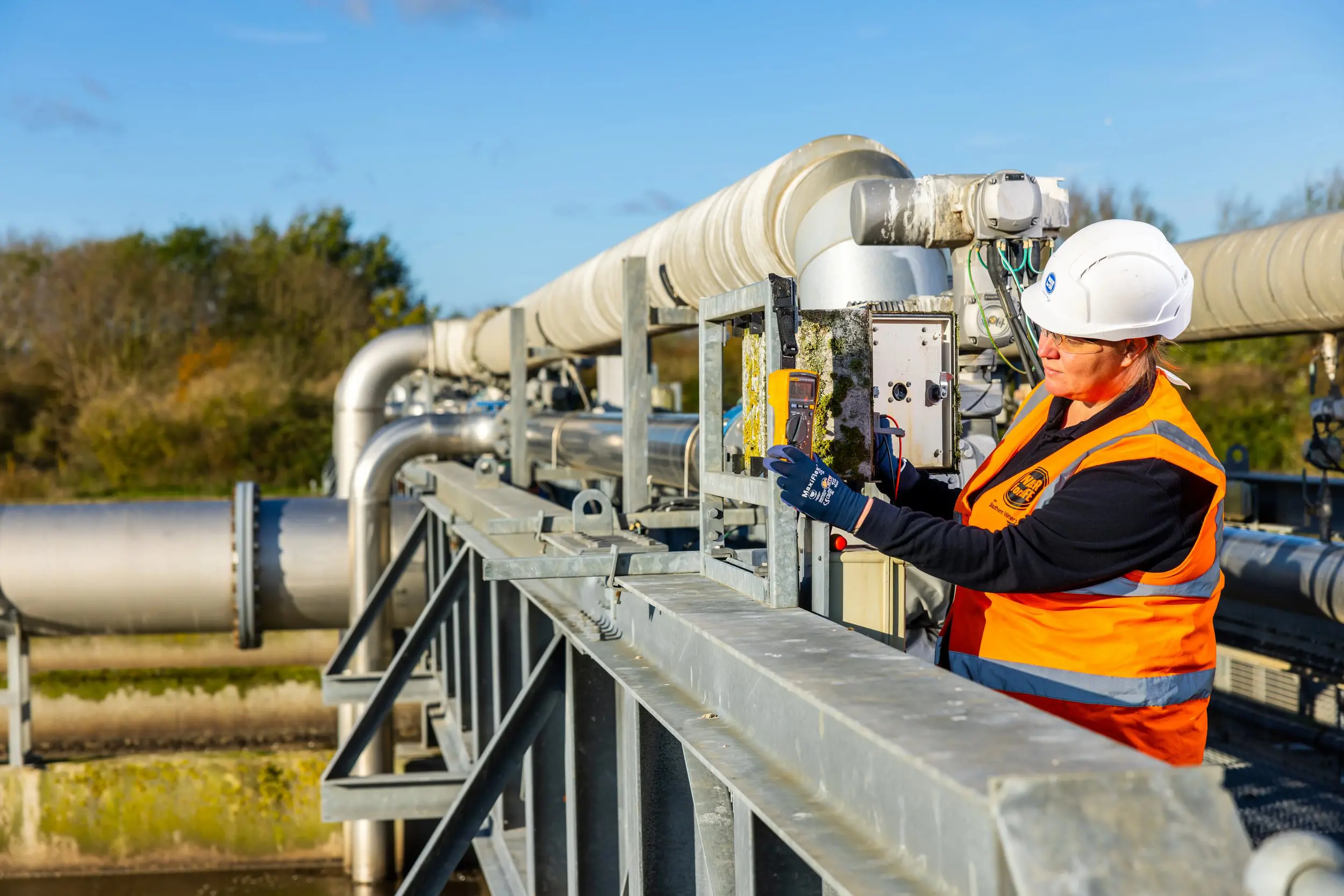 Lady working outside at a Southern Water wastewater treatment site