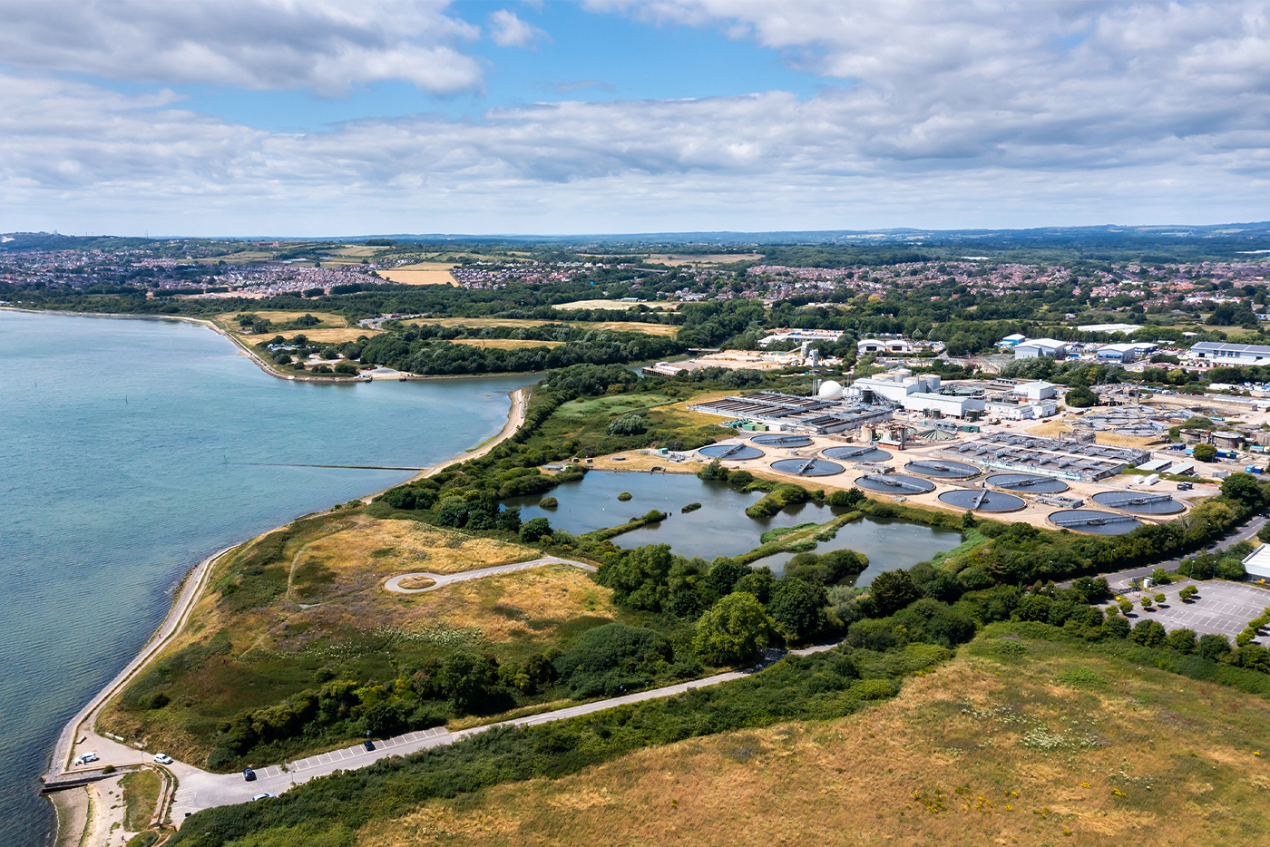 An aerial view of the Budds Farm Wastewater Treatment Works next to Langstone Harbour